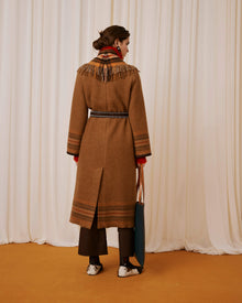 coat with fringes and belt