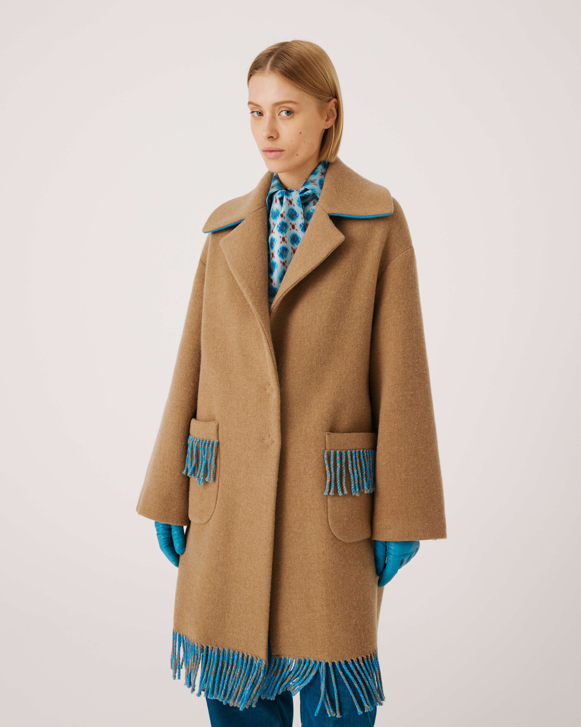 COAT WITH FRINGES AT THE BOTTOM