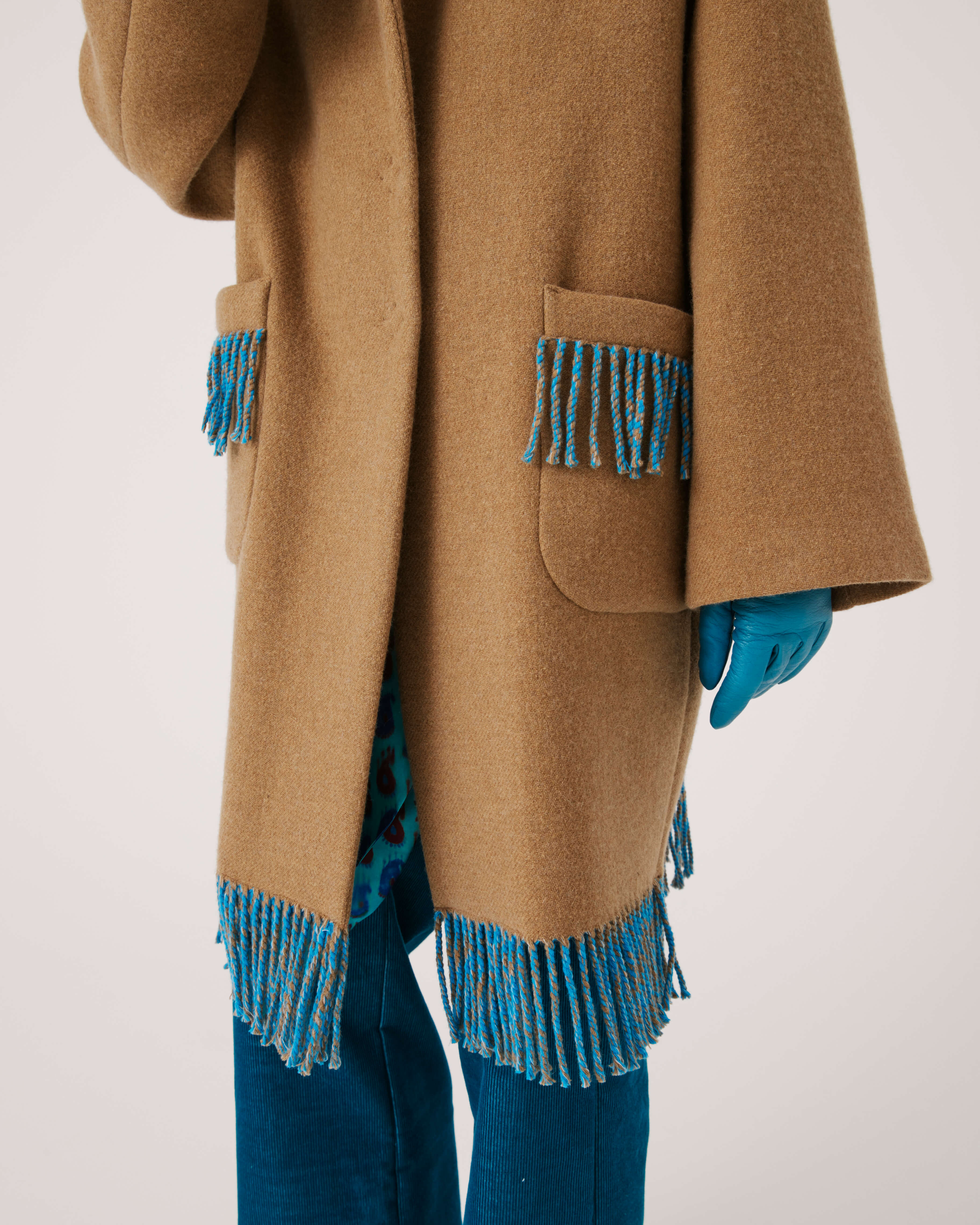 COAT WITH FRINGES AT THE BOTTOM